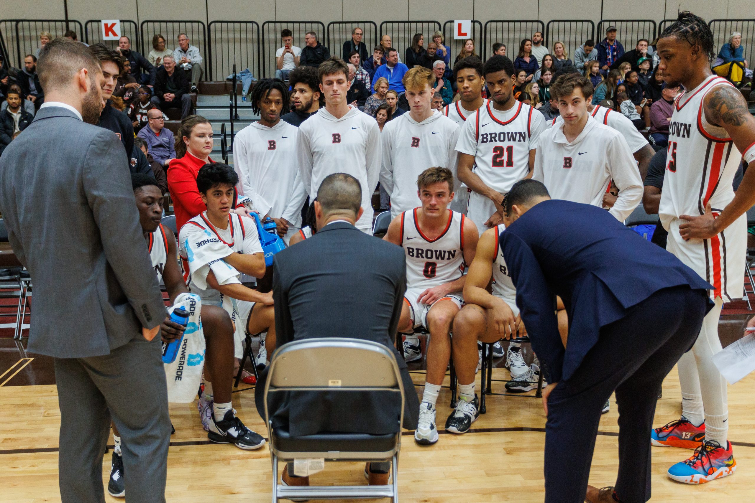 A new NBA coach giving instructions to his team during a crucial mid-season game.