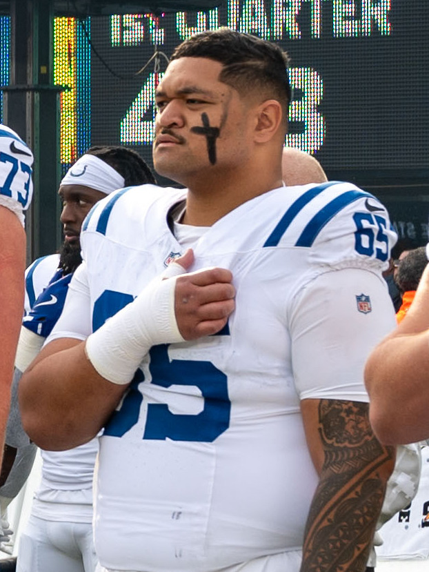 NFL players on the field during a game, highlighting the intensity of the playoff race.