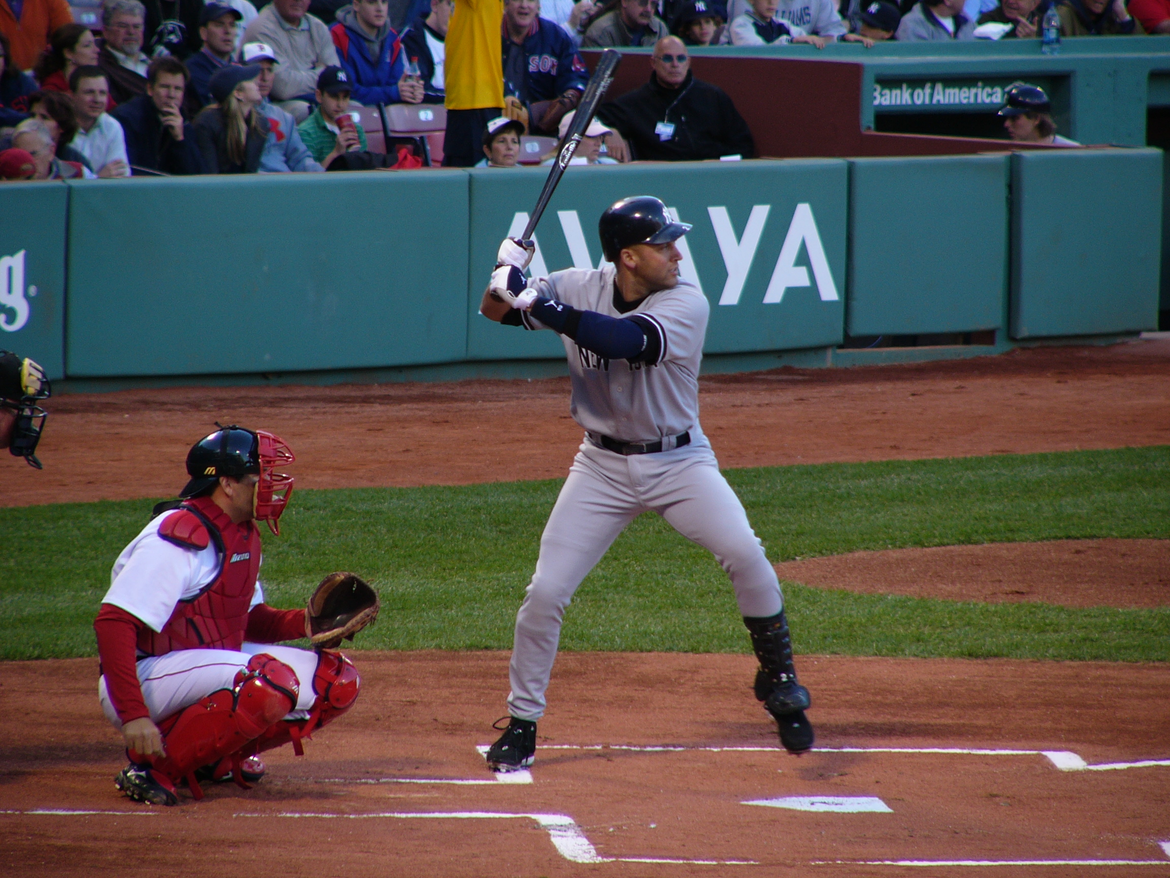 New York Yankees and Boston Red Sox logos with Fenway Park in the background