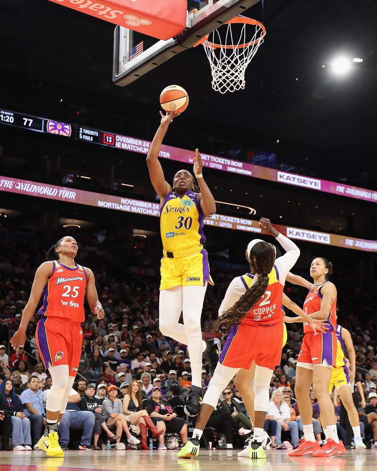 Nneka Ogwumike driving to the basket during a Los Angeles Sparks game.