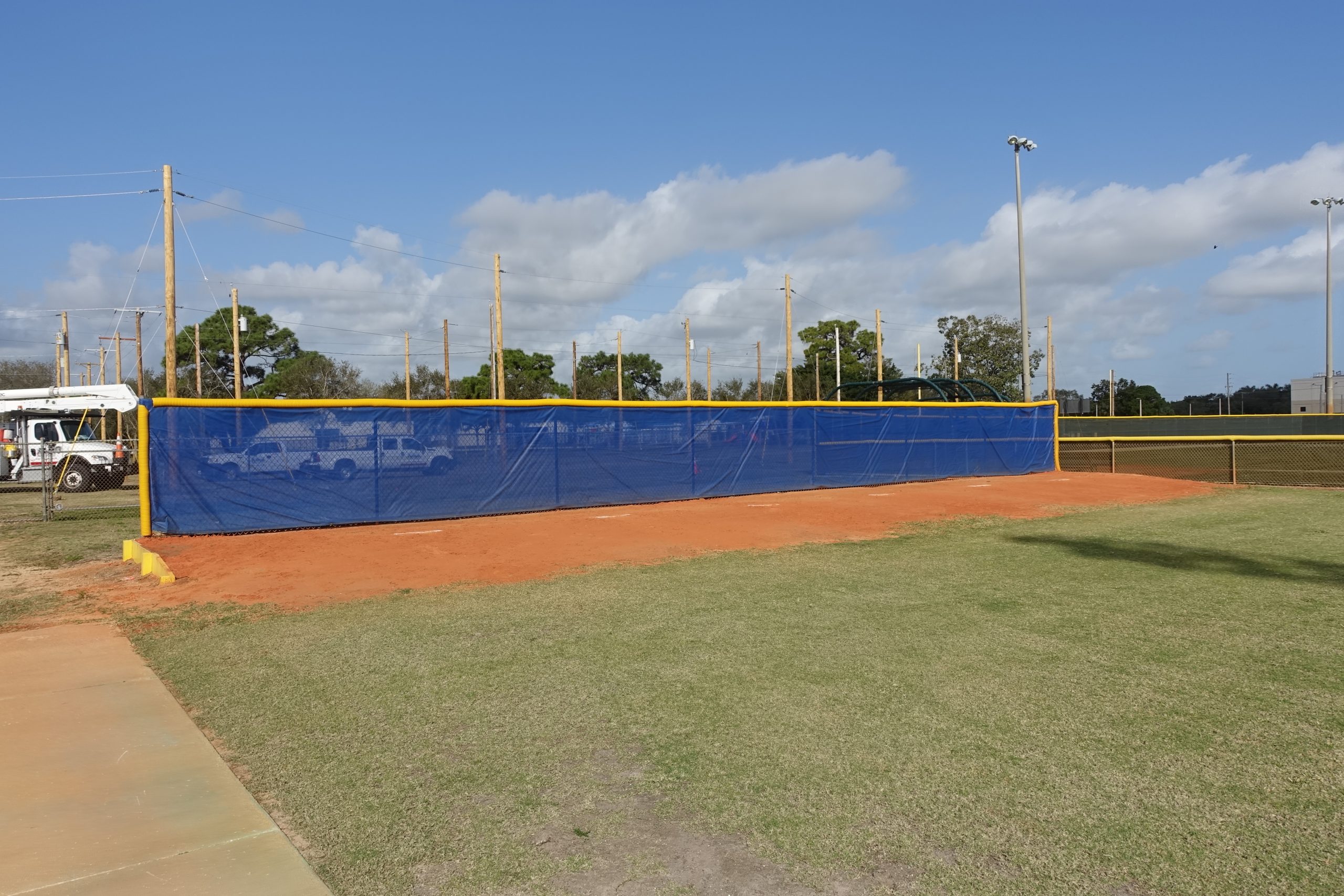 A group of MLB bullpen pitchers on the mound during a game, discussing strategy.