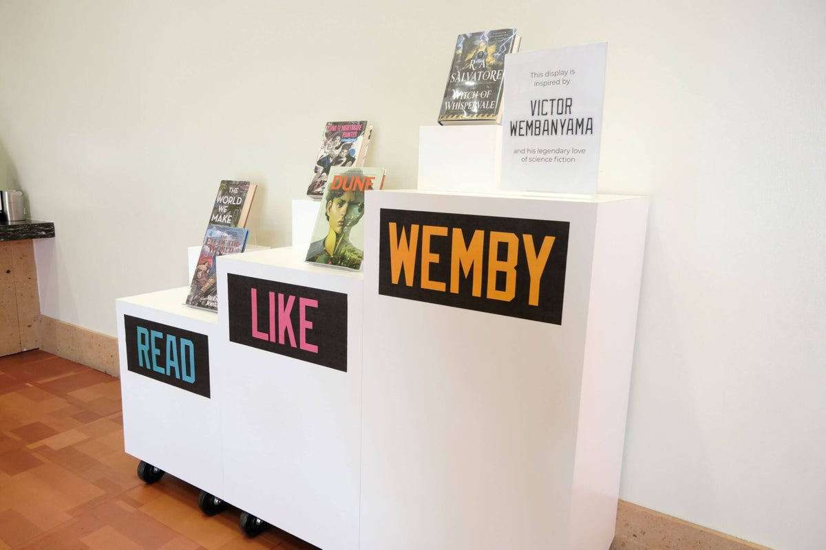 Display of books at San Antonio Central Library as part of the "Read Like Wemby" campaign.