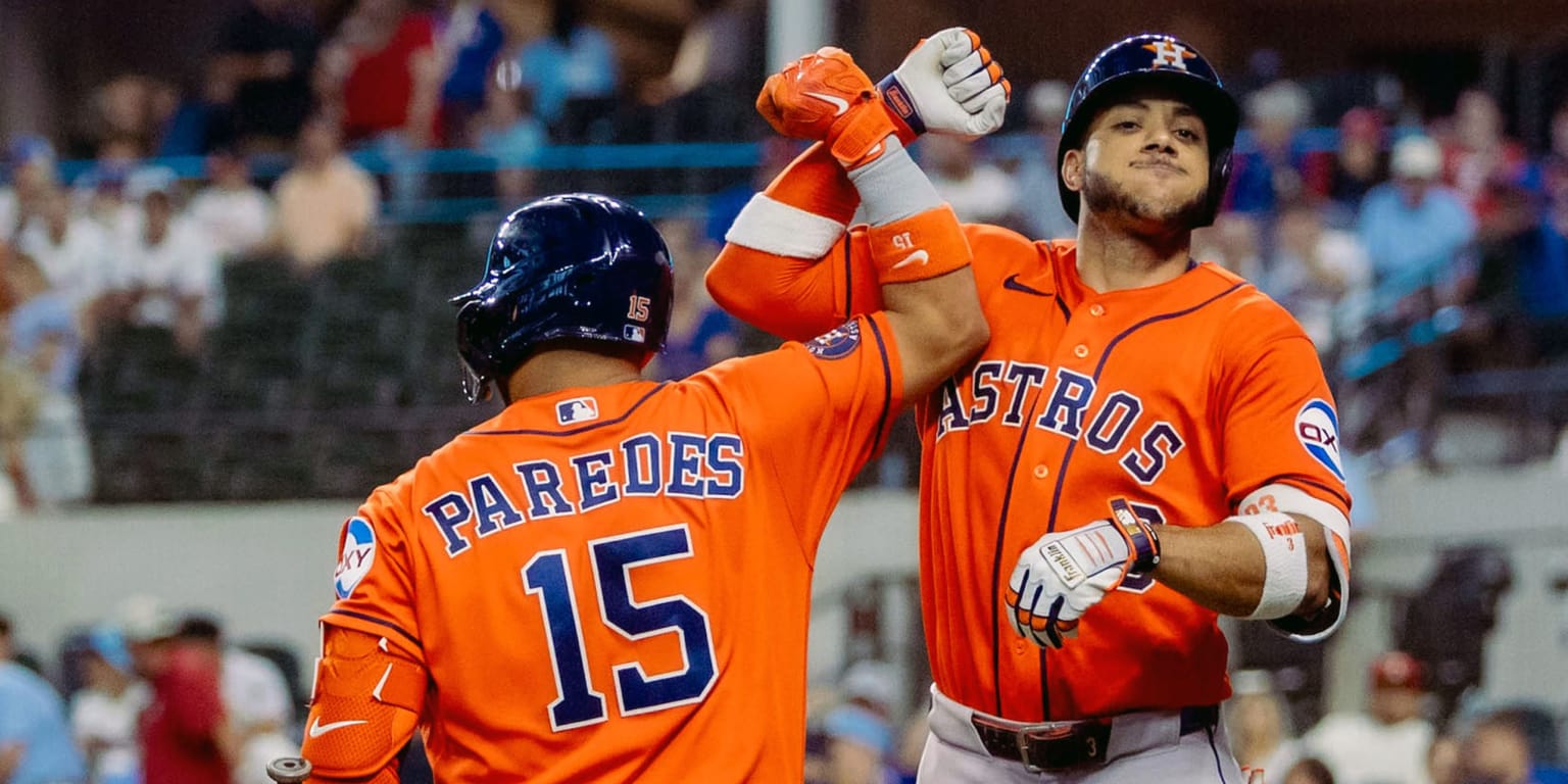 Houston Astros players celebrating on the field after a game