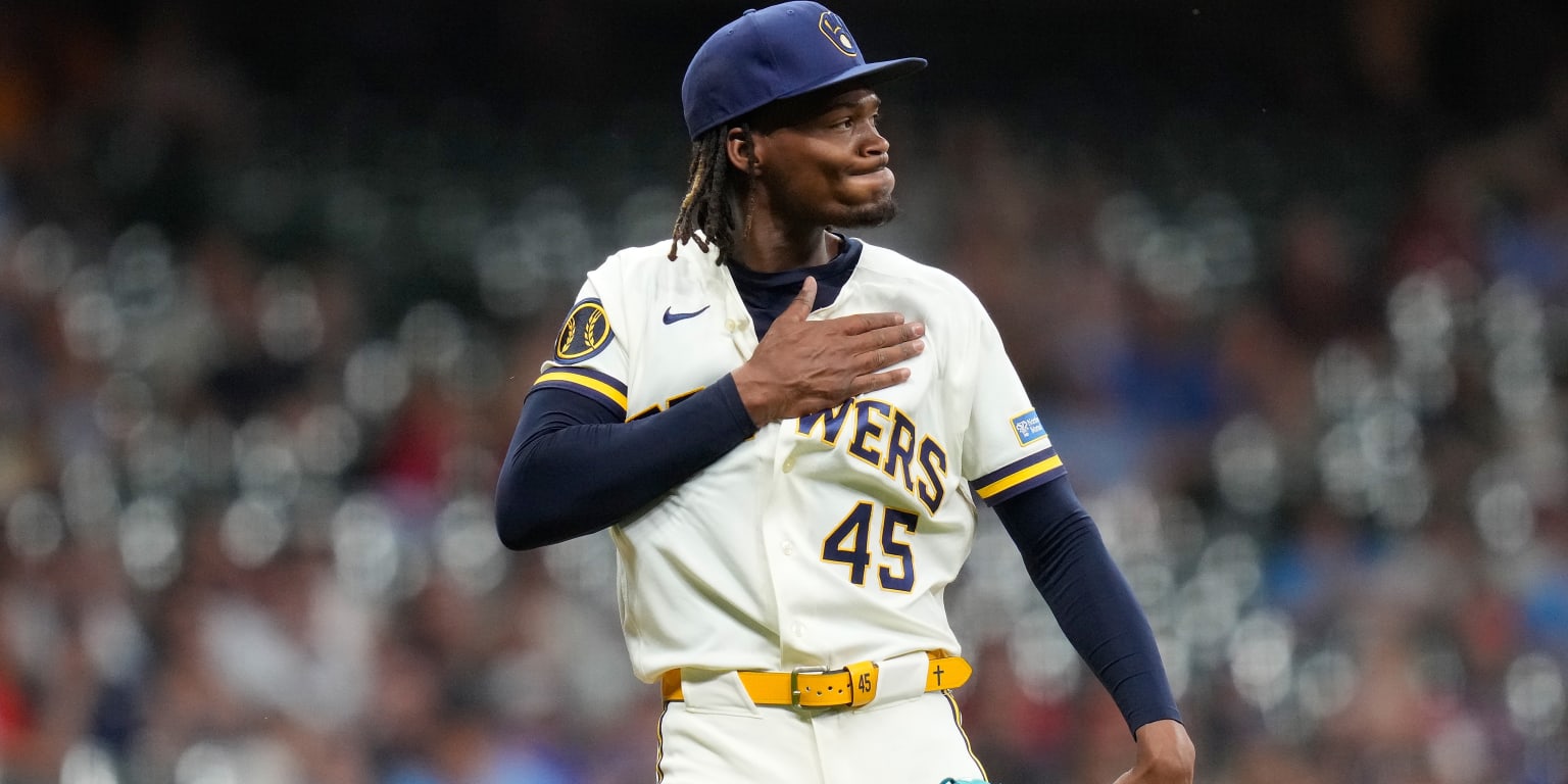 Milwaukee Brewers relief pitcher Abner Uribe in uniform on the baseball field.