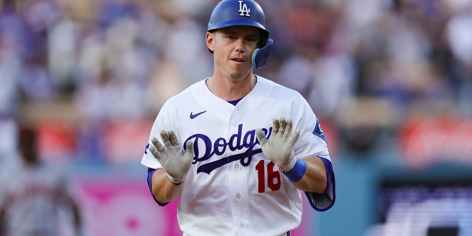 Will Smith of the Los Angeles Dodgers hitting a baseball during a game