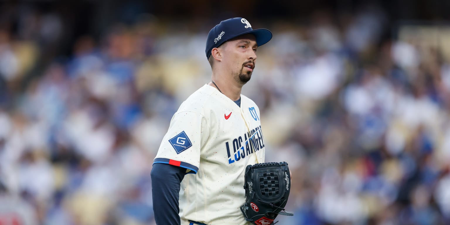 A Los Angeles Dodgers pitcher delivering a pitch from the mound during a baseball game.