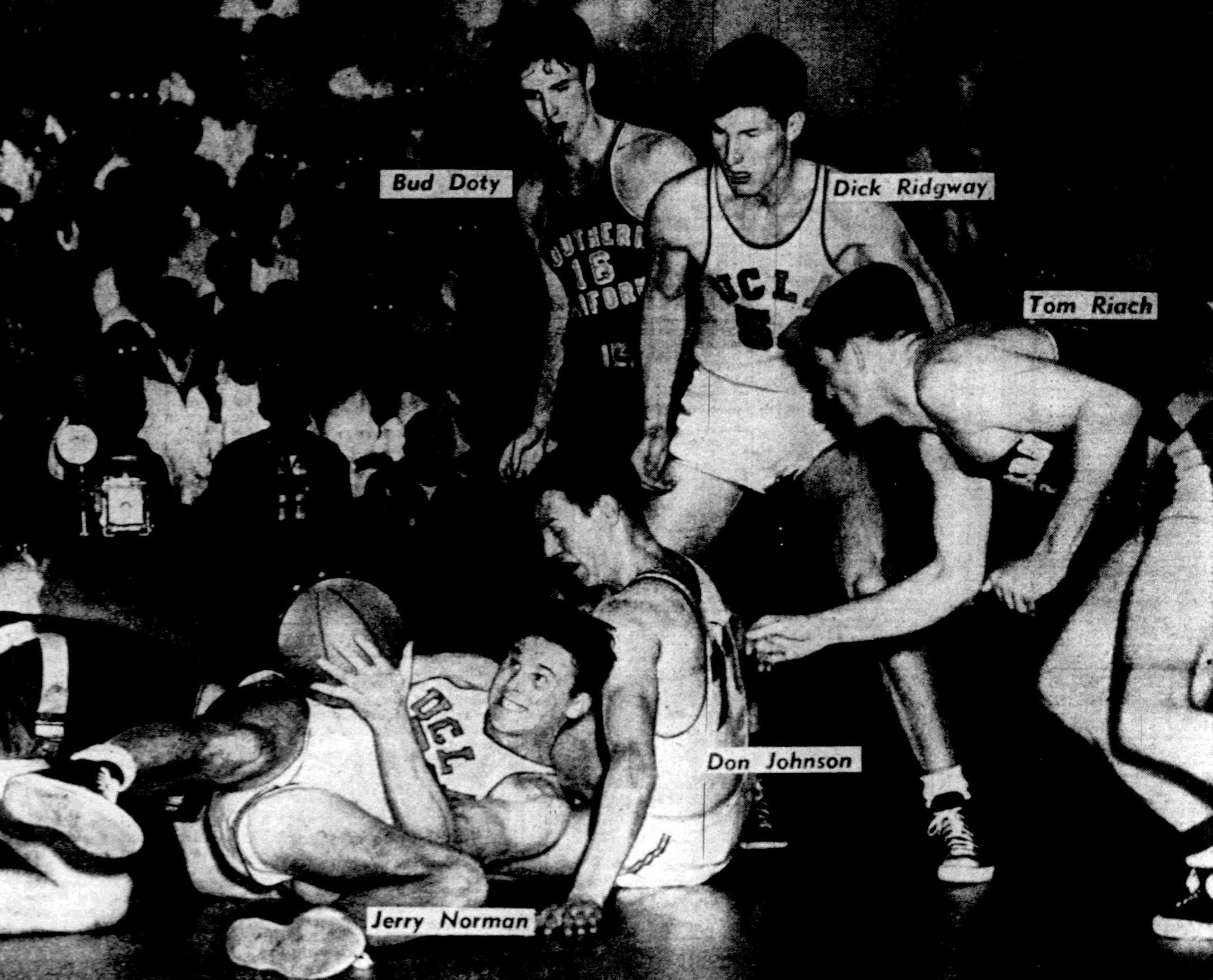 Basketball players competing on an NBA court during a game