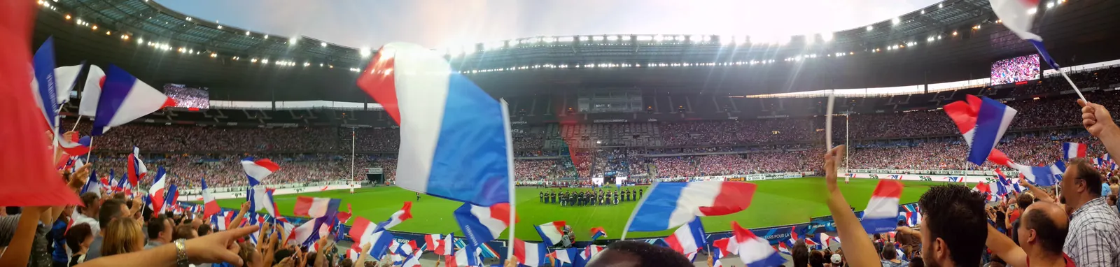 Players from France and England rugby teams in action during a match.