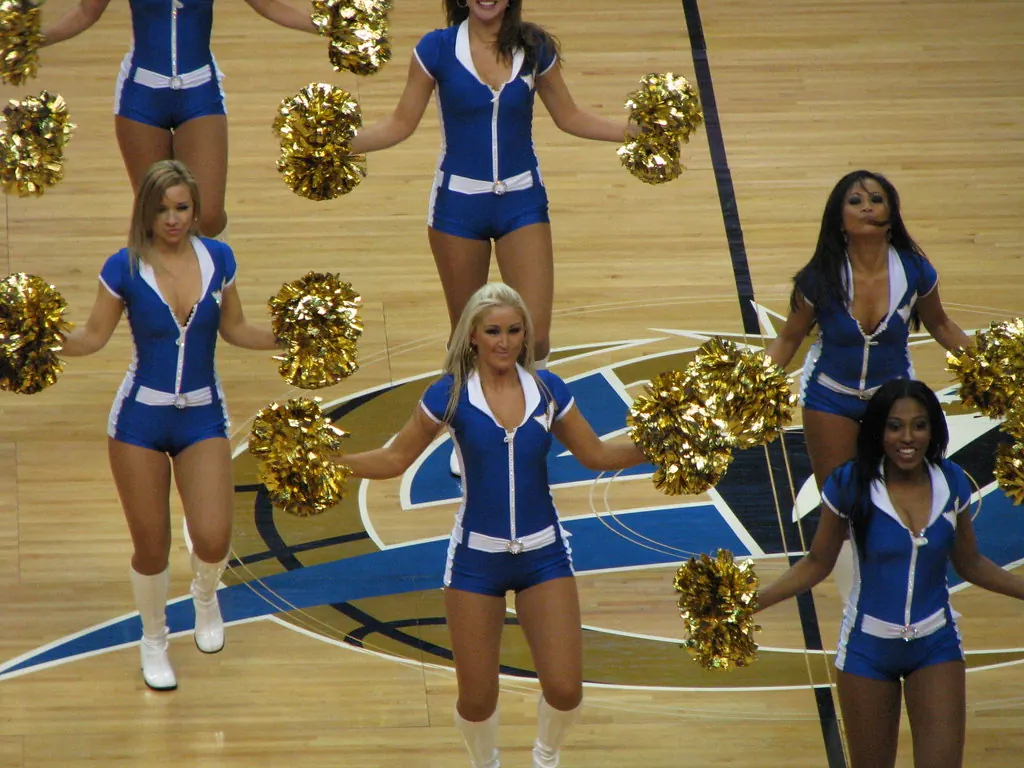 Basketball players competing intensely on a court during an NBA game.