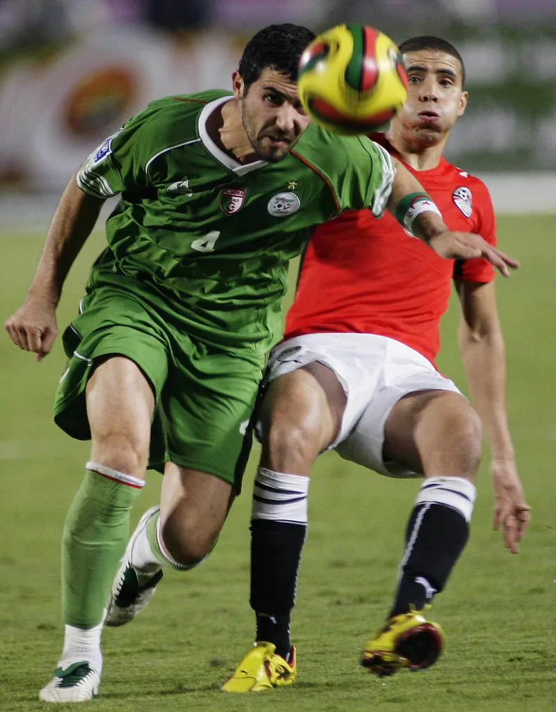 Algeria players celebrate a goal against Jordan during their FIFA World Cup match.