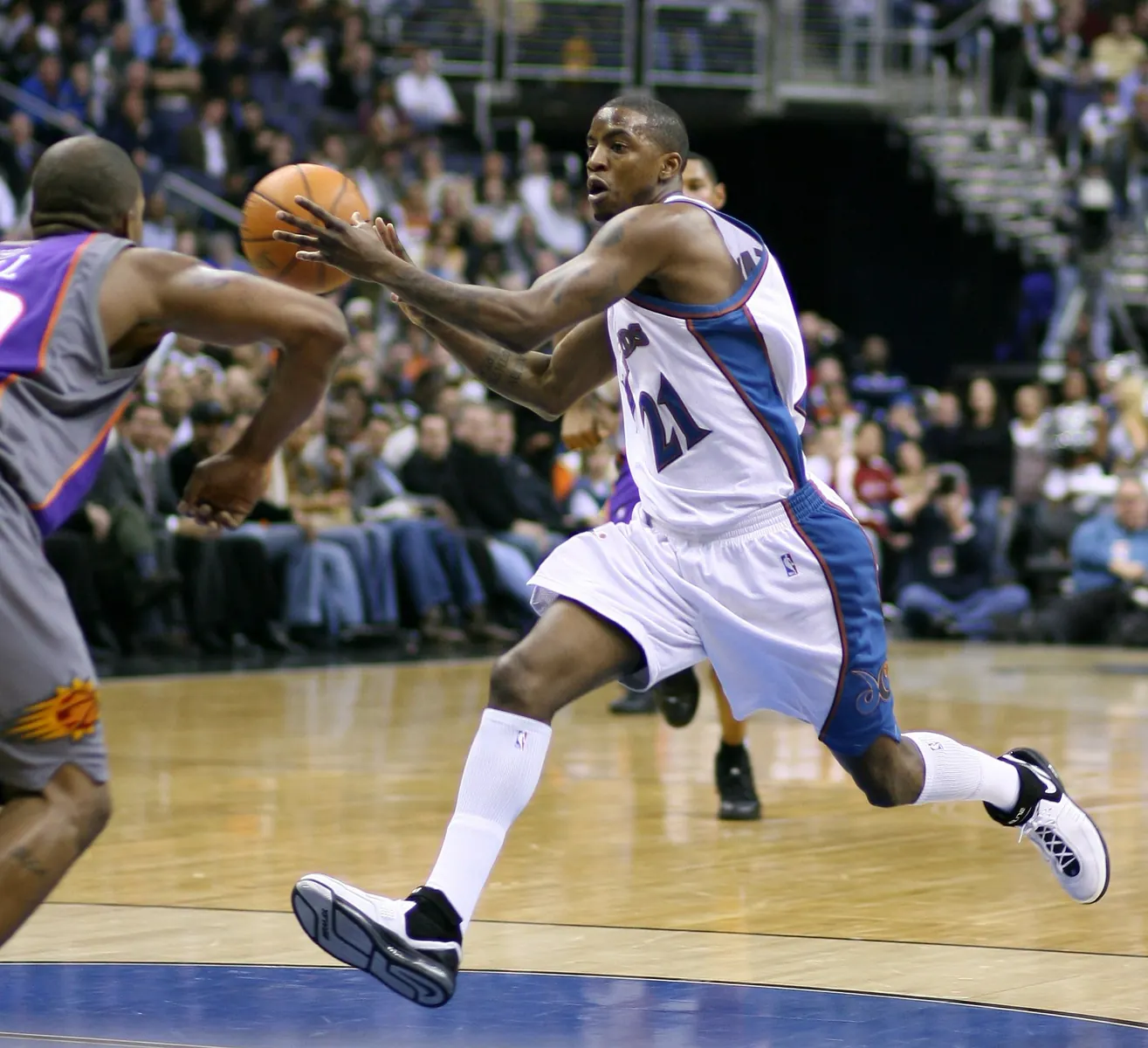 NBA players in action during a game, with graphics indicating team trades