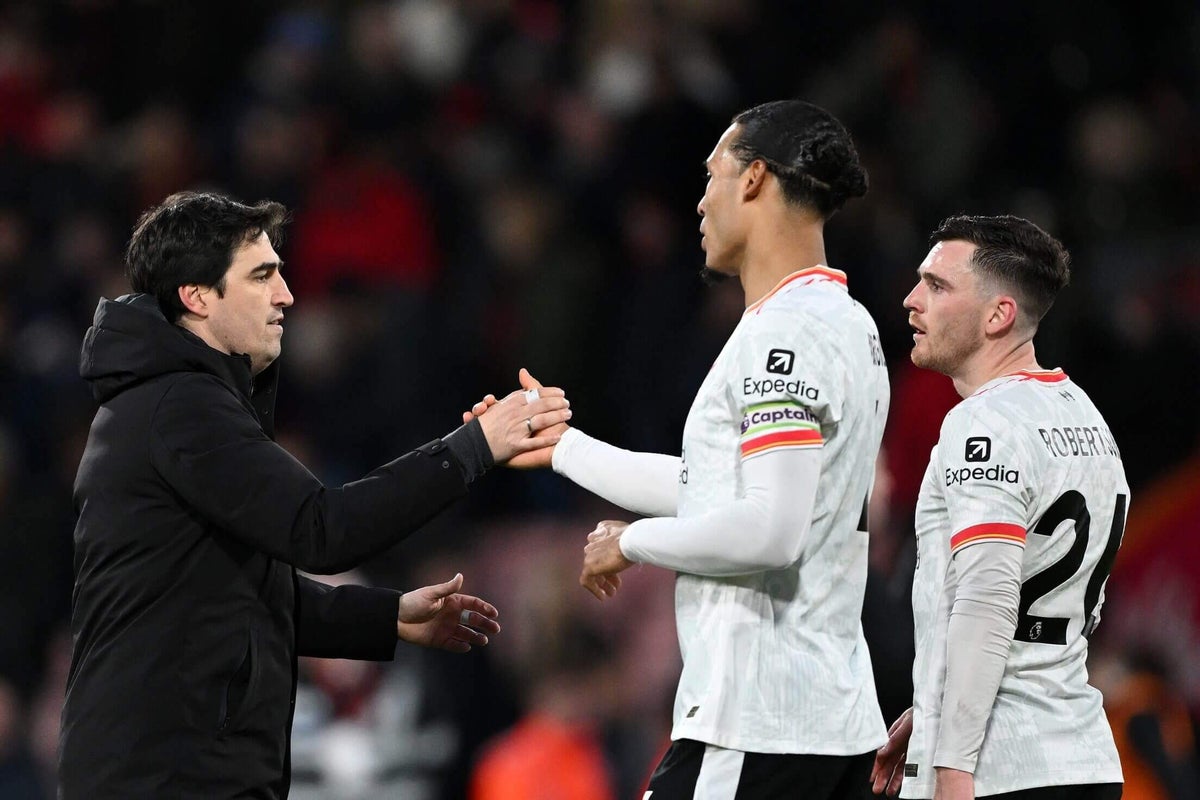 Andoni Iraola and Virgil van Dijk in discussion during a Liverpool training session.