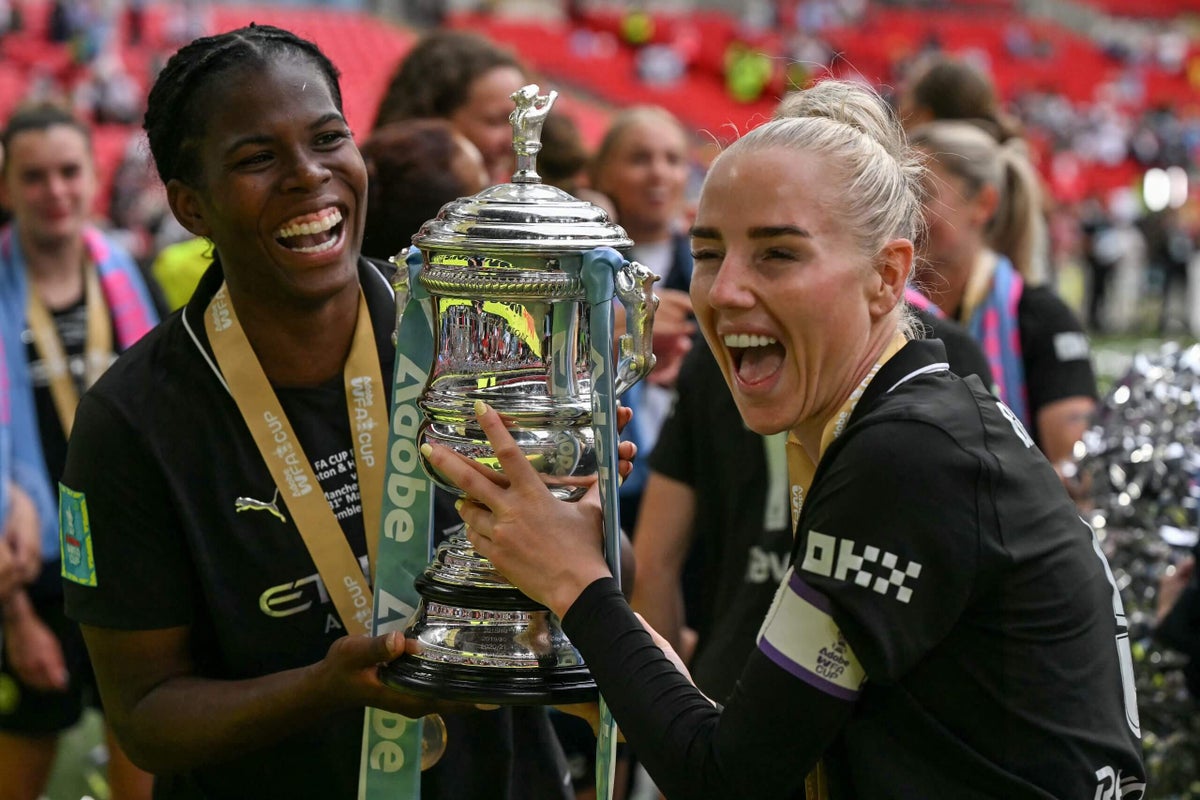 Manchester City players celebrating their Women's FA Cup final victory.