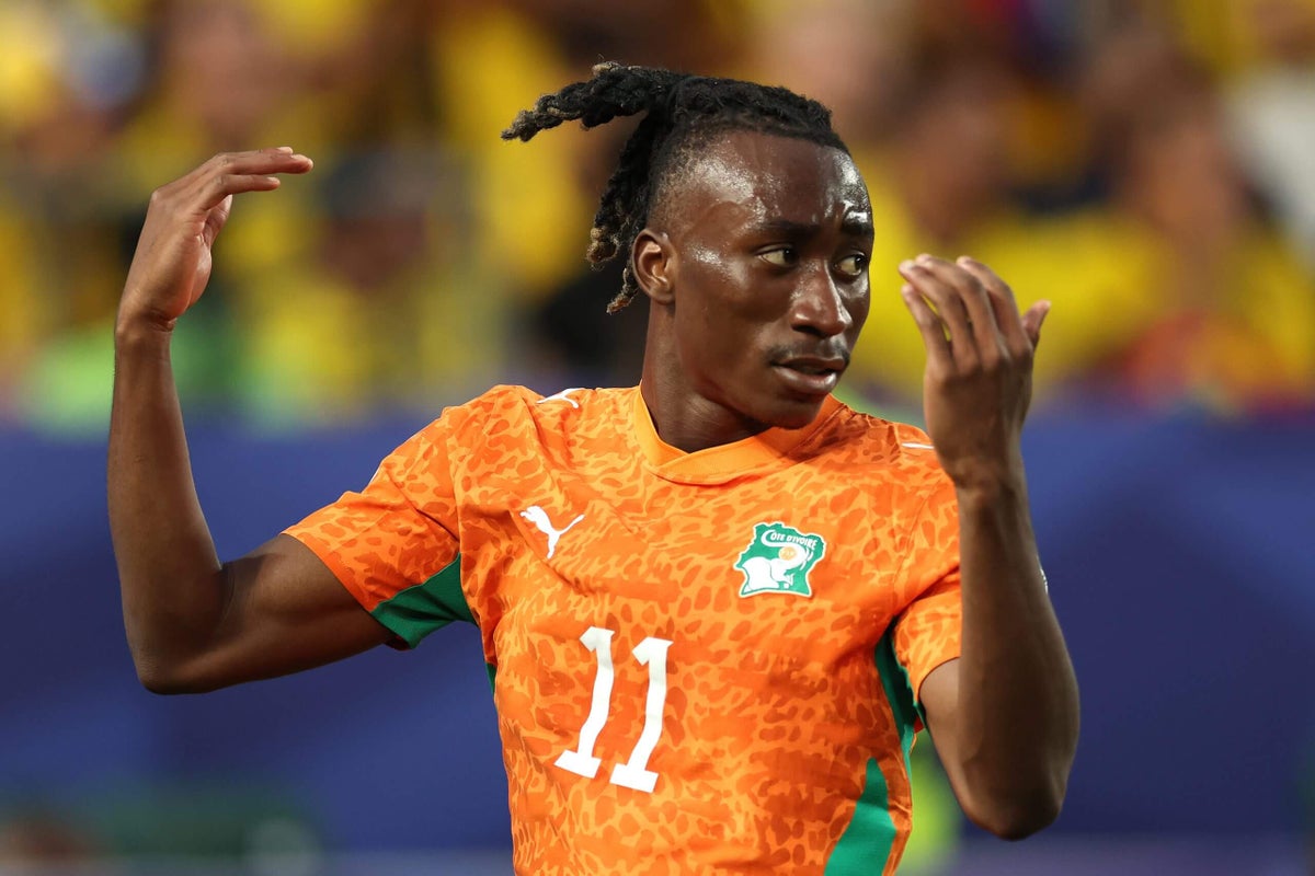 Yan Diomande of Ivory Coast evades an Ecuador defender during a World Cup match.