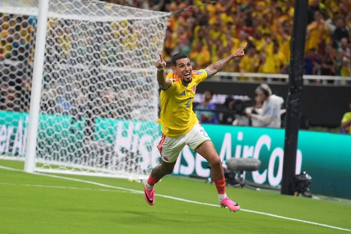 Colombian players celebrate a decisive goal during a World Cup match.