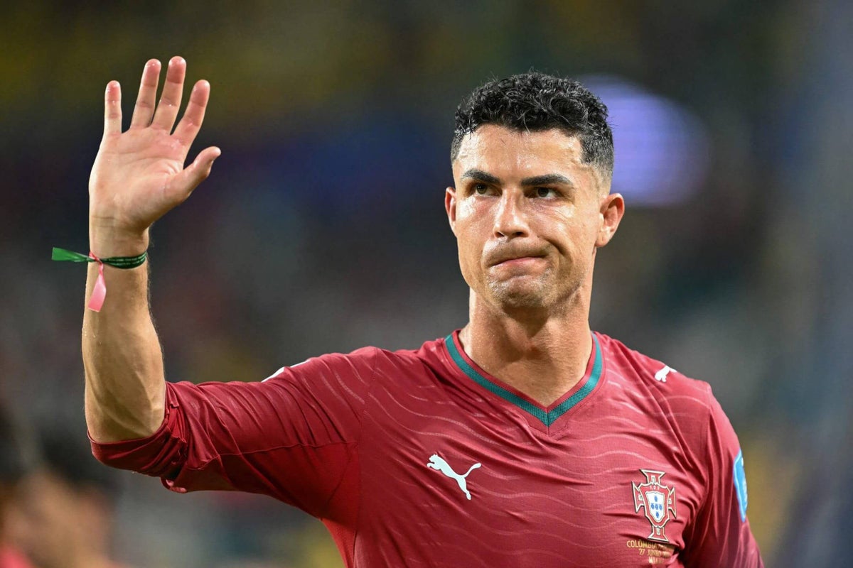 A FIFA World Cup 2026 match in progress, with players from Portugal and Colombia on the field.