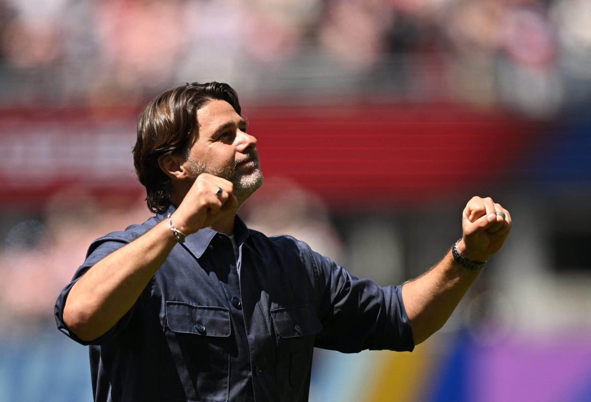 USMNT coach Mauricio Pochettino celebrating a victory with his team.