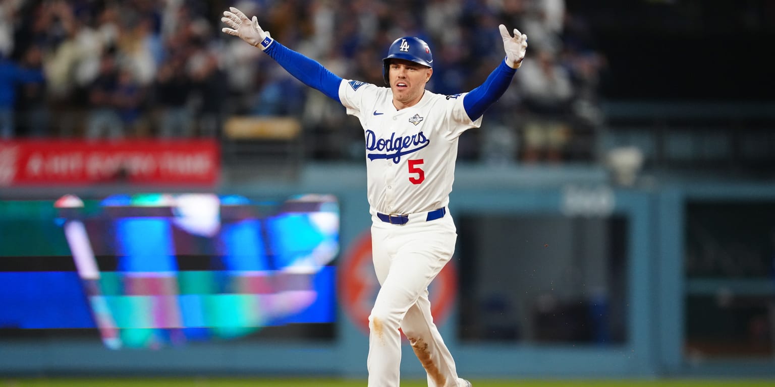 Freddie Freeman celebrating a walk-off home run on the baseball field