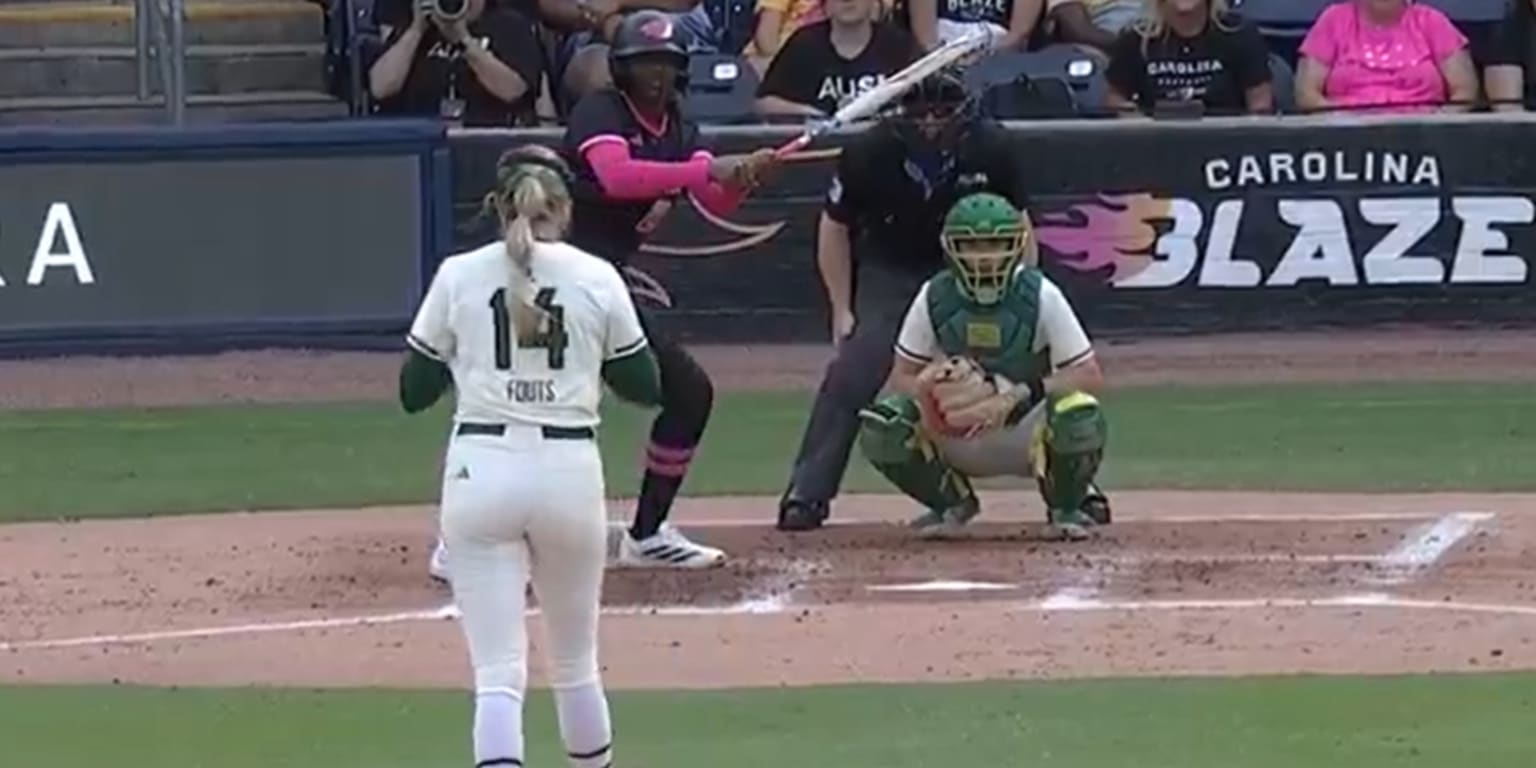 Pitcher Montana Fouts in action on the mound during a softball game.