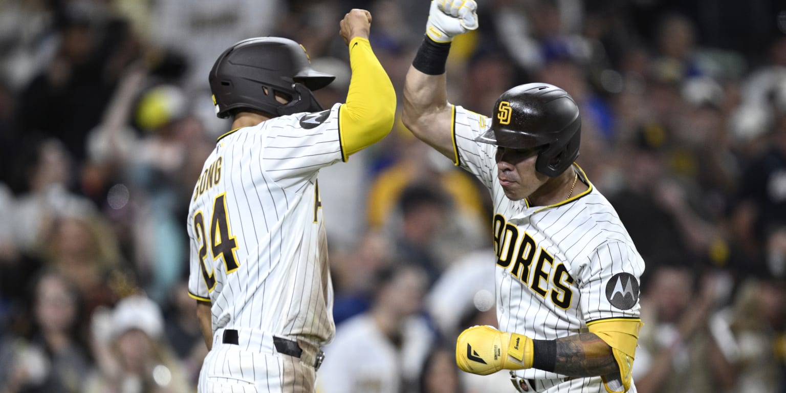 Freddy Fermin of the San Diego Padres rounding the bases after hitting a home run.