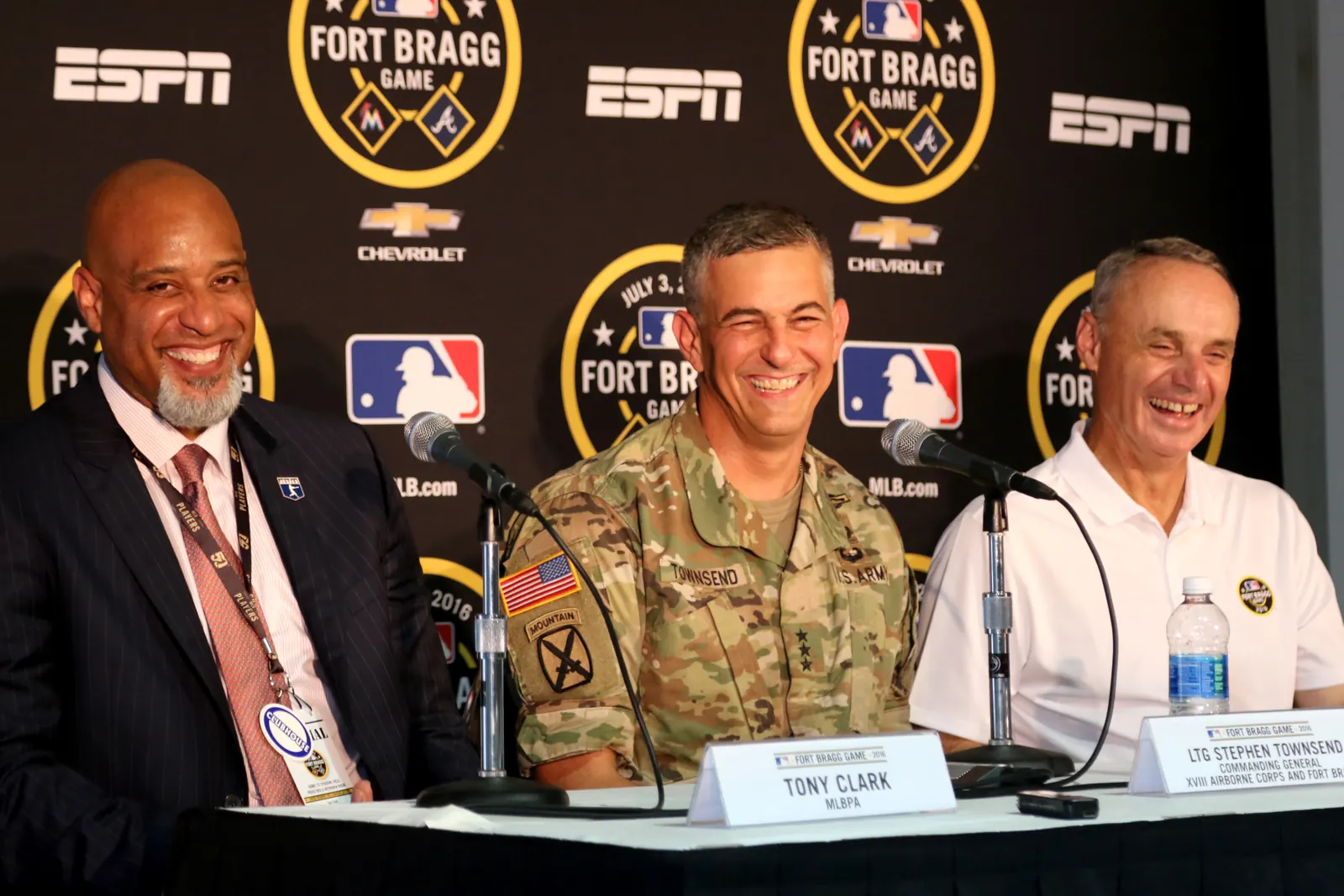 MLB Commissioner Rob Manfred speaking at a podium.
