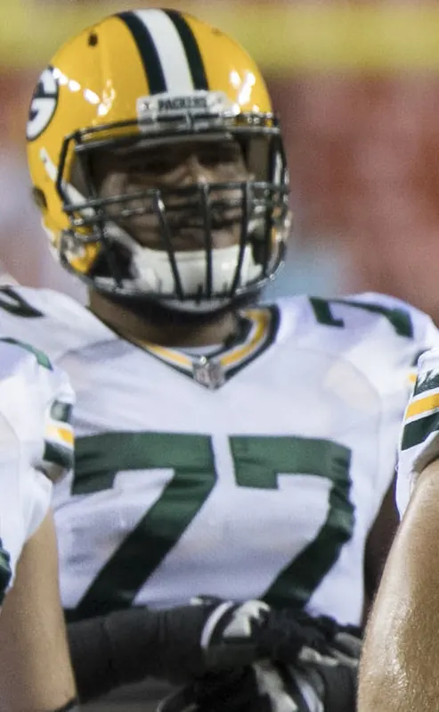 NFL players in a competitive game, symbolizing the playoff race and the physical demands on athletes.