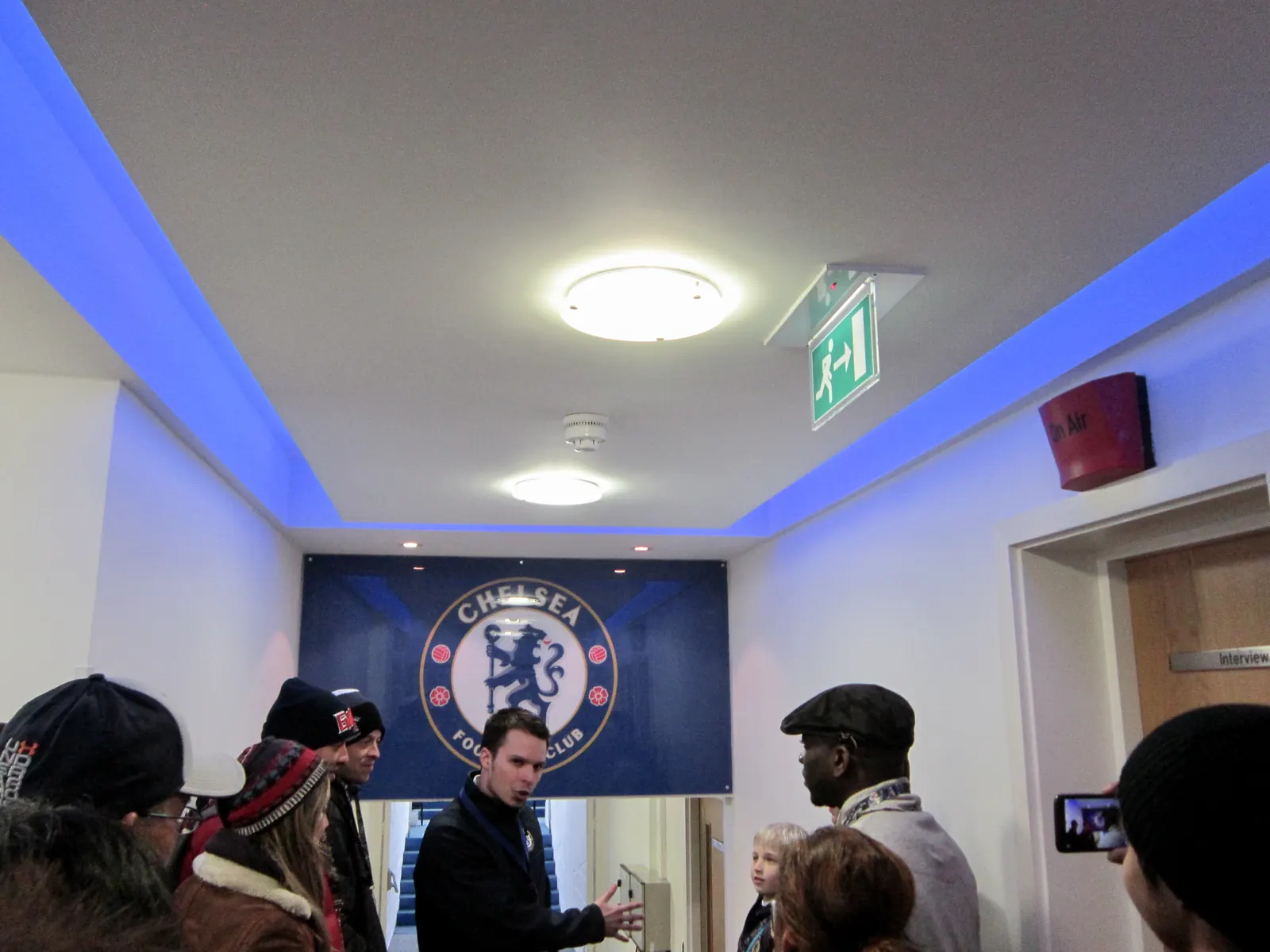Chelsea FC logo alongside images of Alex Scott and John Stones