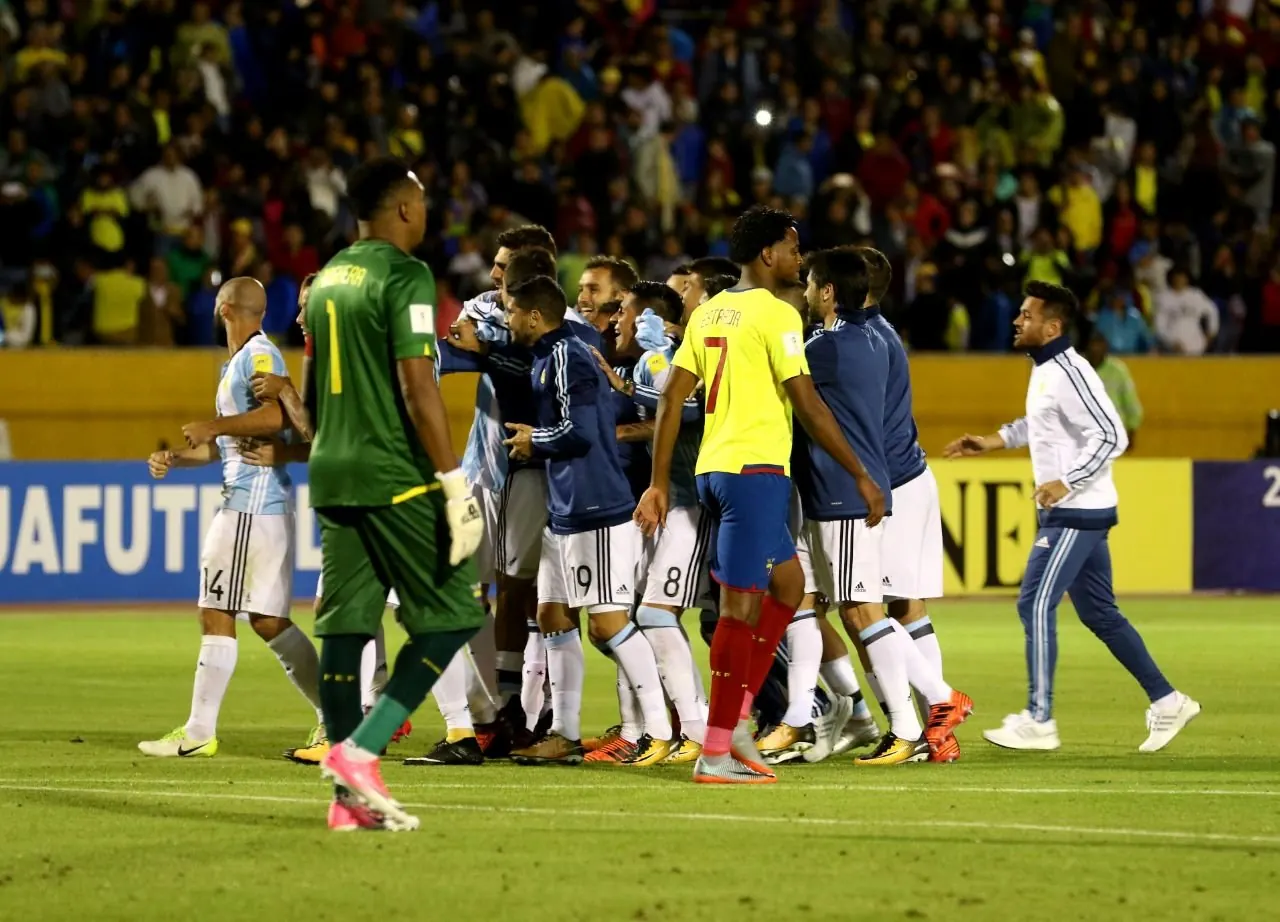 A tense moment during the World Cup semi-final match between England and Argentina, with players contesting possession.