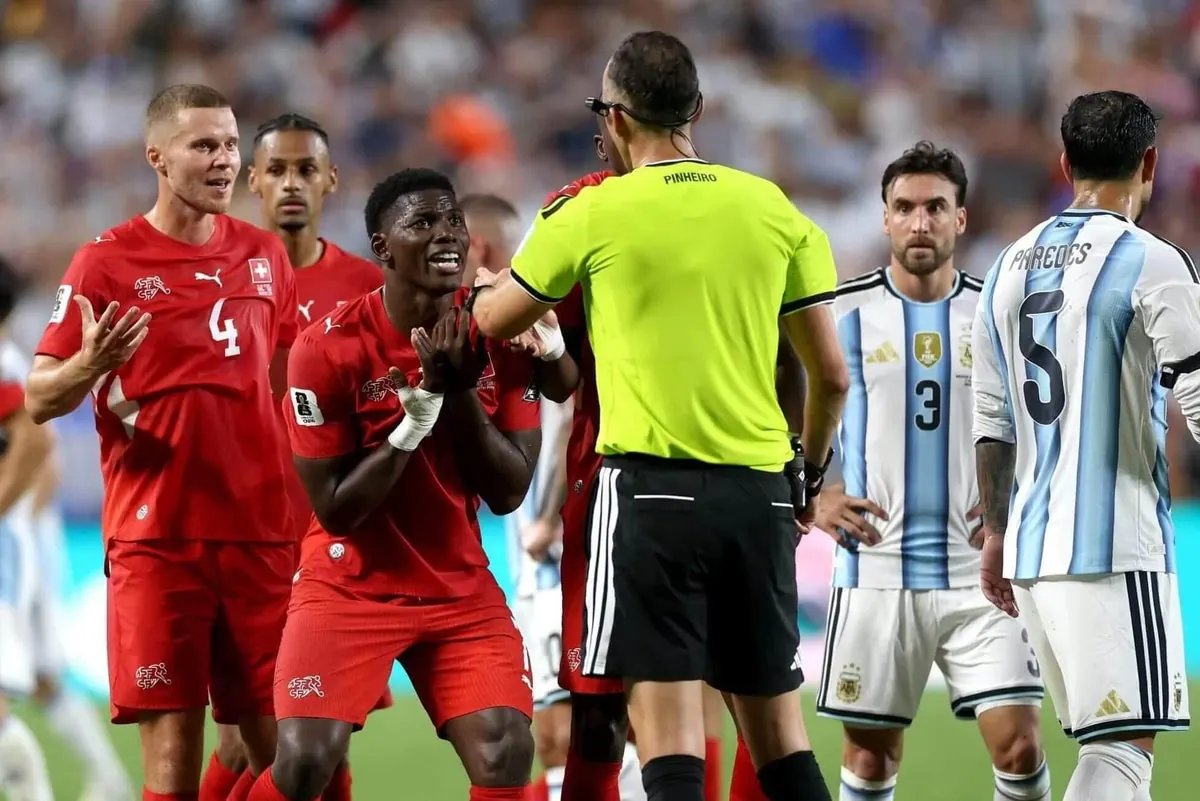 Breel Embolo reacting after receiving a red card during the World Cup match.