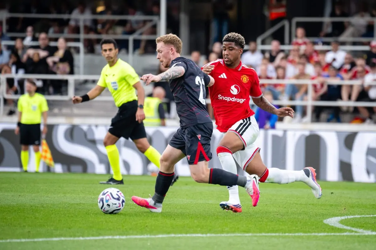 Manchester United players in action during a pre-season friendly match.