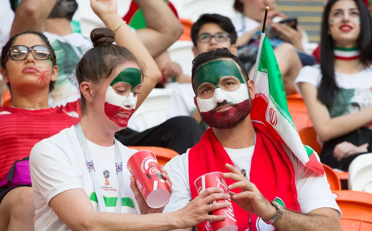 Soccer players in a World Cup match, representing African teams.