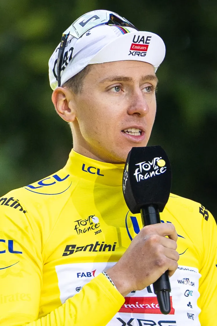Tadej Pogacar celebrates his fifth Tour de France victory on the podium in Paris after the 2026 race