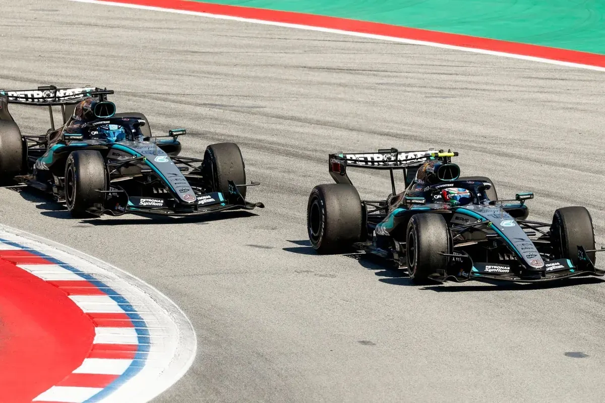 Formula 1 driver George Russell at the wheel of his Mercedes car during a Grand Prix event.