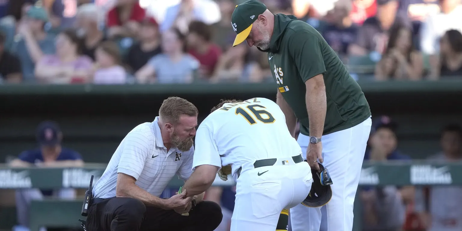 Nick Kurtz grimacing after being hit by a 94.9 mph sinker on his left forearm during the first inning of a game against the Red Sox at Sutter Health Park