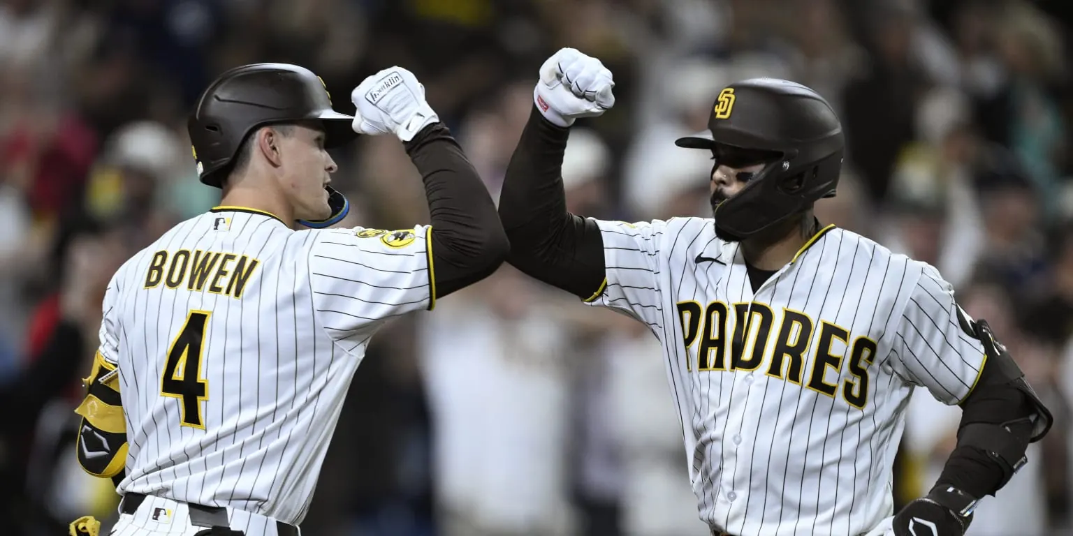 San Diego Padres players celebrating a baseball game victory.