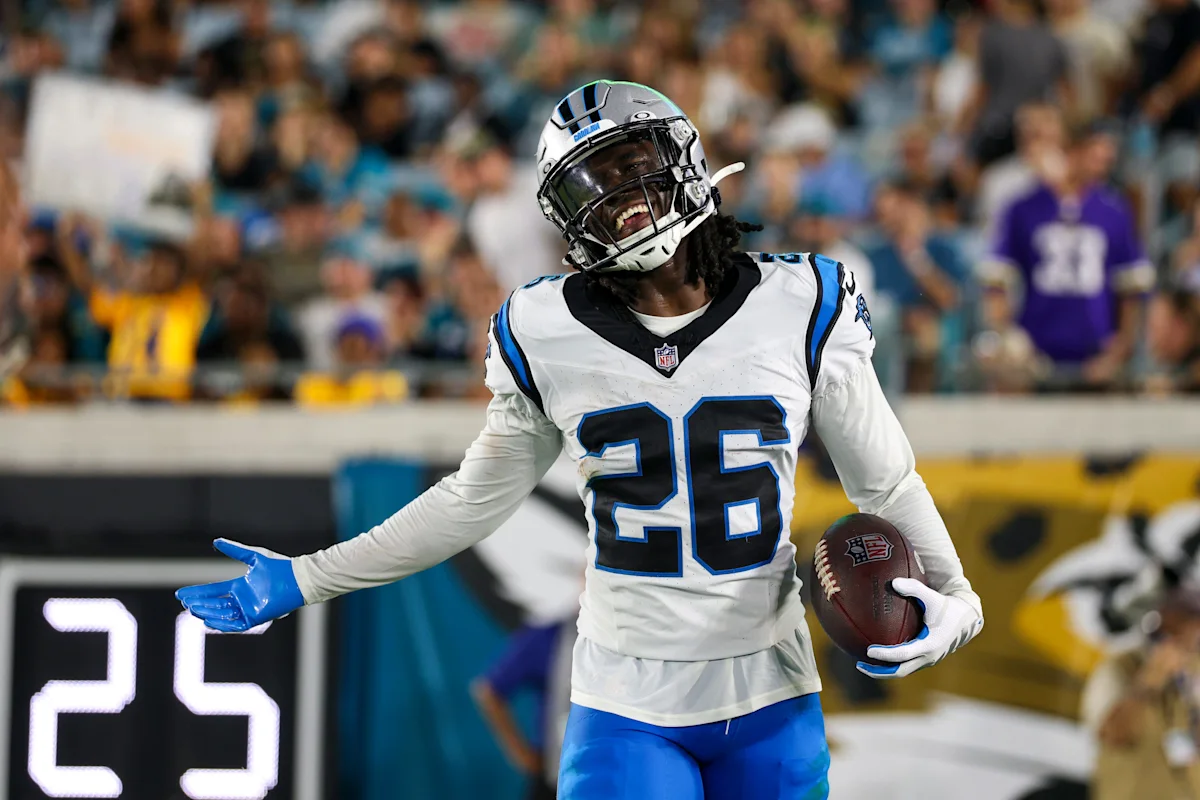 Carolina Panthers running back Trevor Etienne carries the ball against the Jacksonville Jaguars during a preseason NFL game in Jacksonville, Florida.