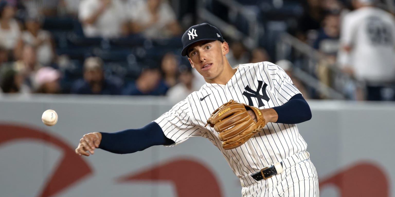 New York Yankees shortstop George Lombard Jr. prepares to field a ground ball during a game against the Houston Astros at Yankee Stadium