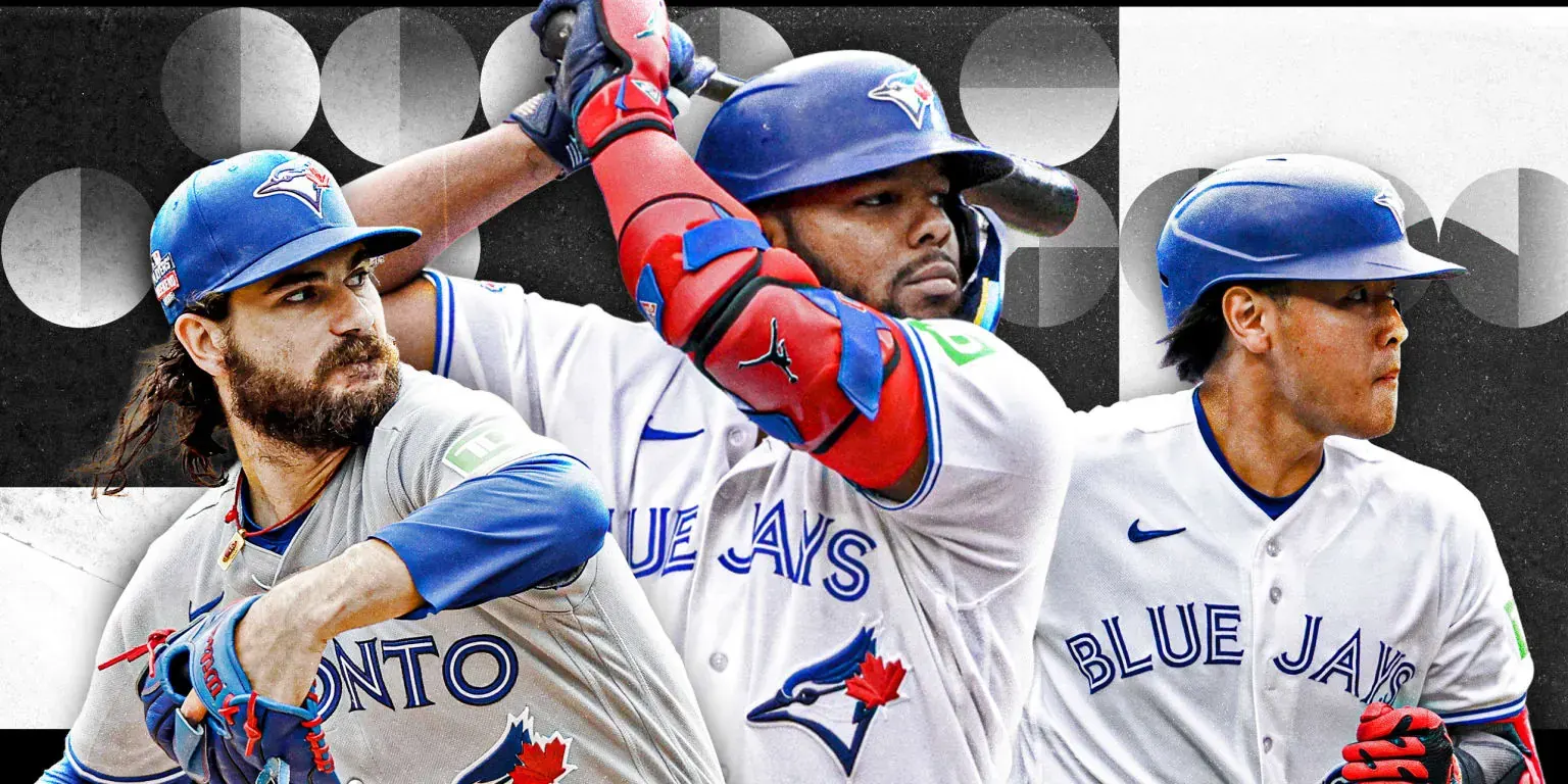 Blue Jays players in the dugout at Rogers Centre during a September 2026 game, with fans in the stands